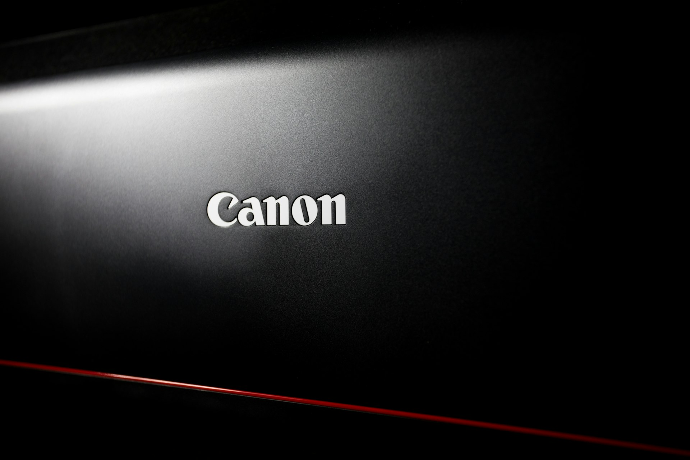 a black laptop with the word canon on it